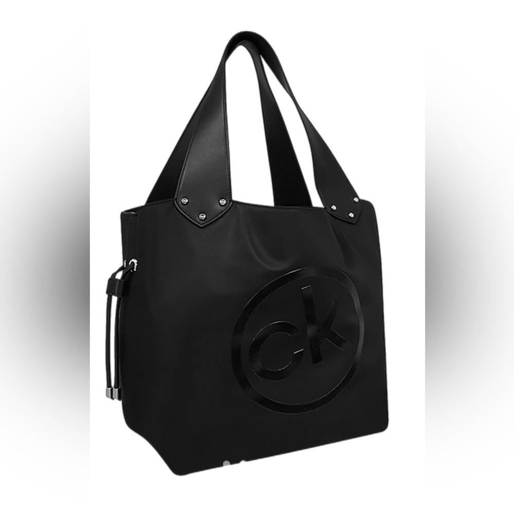CK drawstring bucket bag. Plastic still on the hardware. And smells great.